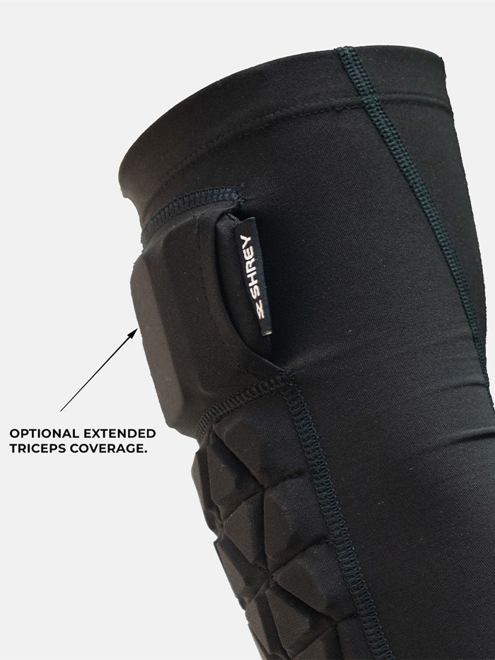 Shrey Legacy arm guard flatlock seams and 3D silicon branding detail