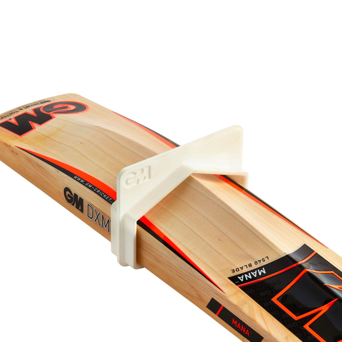 GM bat gauge in use - cricket bat blade passed through the gauge aperture to check width, depth and edge limits